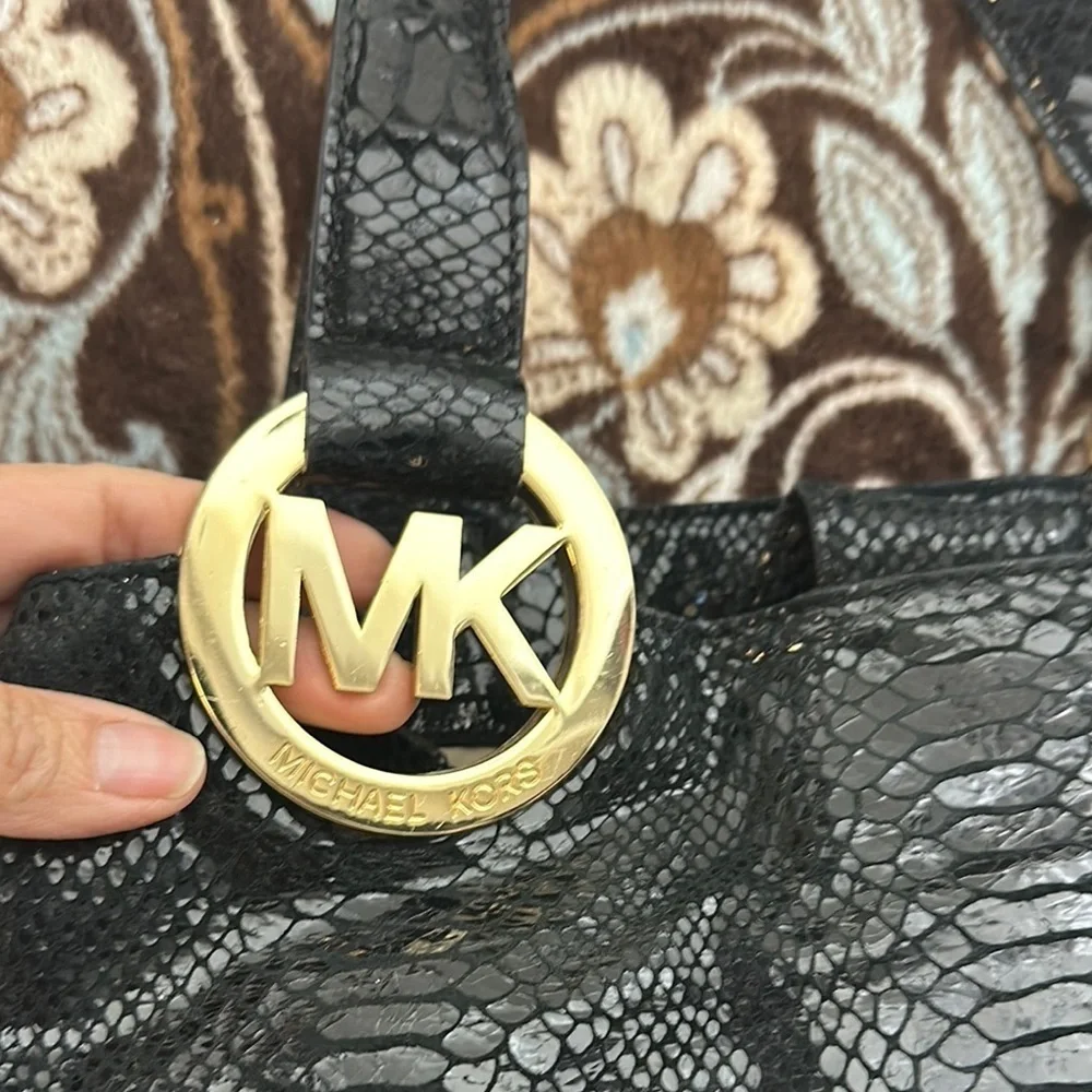 Michael Kors Black Hobo Bag with Gold Emblem